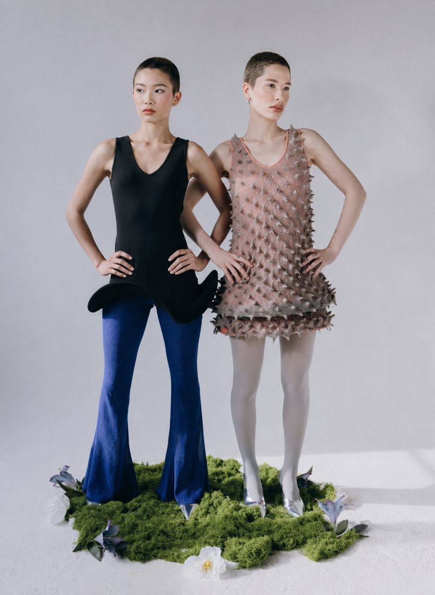 Two models in a black knit top with flared trousers and a textured pink knit mini dress